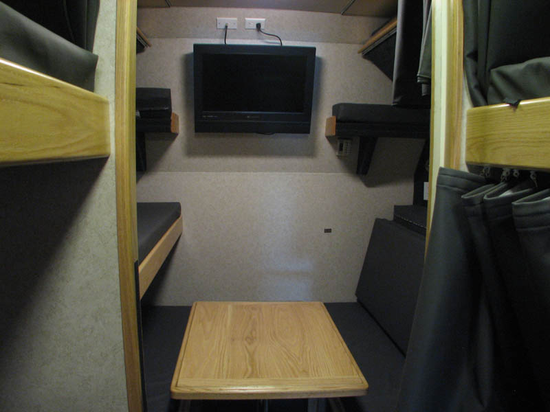 Rear lounge area with large wall TV as well as bunk TV,s to use when this area is converted into 6 beds