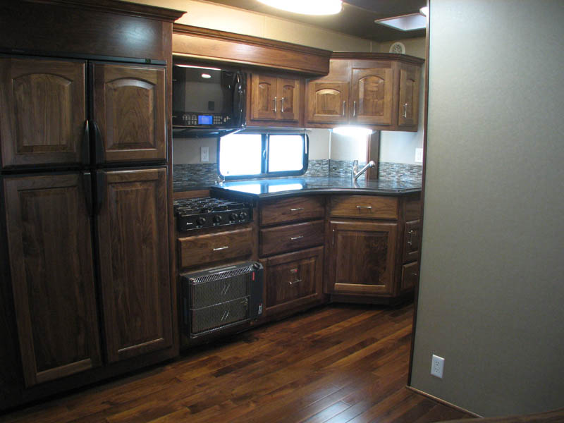 4 door fridge freezer, burner top, dish washer, granite countertops, true convection microwave, and cateletic heater (All Black Walnut very rich looking)